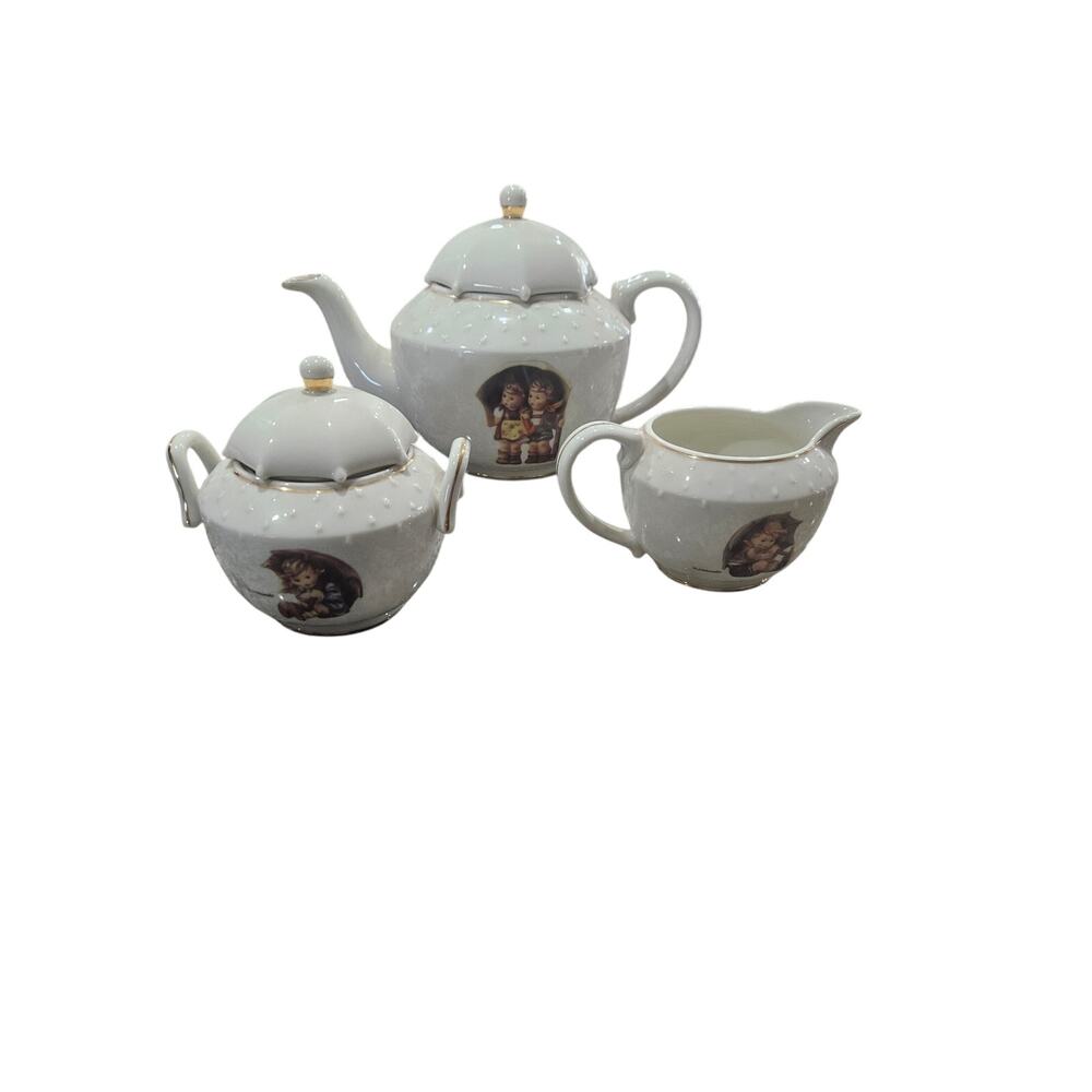 M. J. Hummel Stormy Weather Teapot Creamer and Sugar Bowl Set